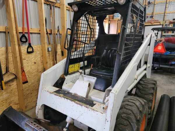 Bobcat 743 Skid Loader with bucket and forks for sale